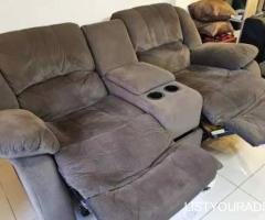 Recliner sofa with rocking movement and storage